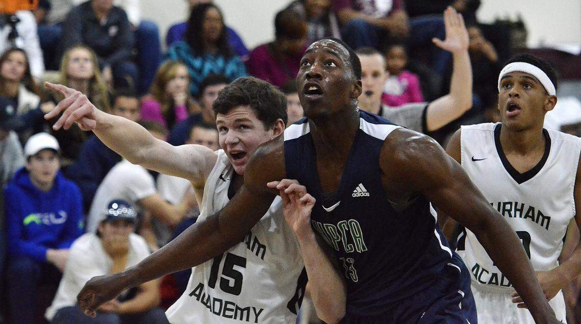 High Point Christian power forward Edrice "Bam" Adebayo, #13, battles Nick Beisher, #15, of Durham Academy on Nov. 21, 2015.
