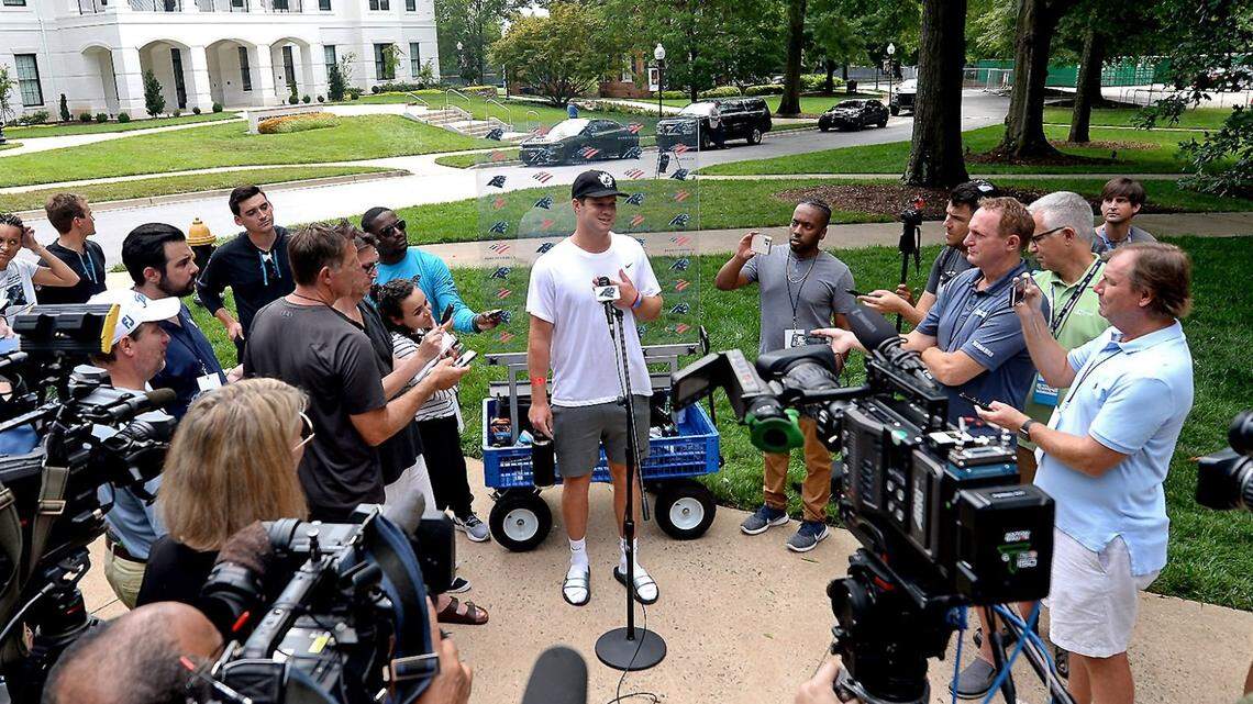 Carolina Panthers quarterback Sam Darnold, center, speaks to the media at Wofford College in Spartanburg, SC on Tuesday, July 27, 2021. The Panthers will hold their first training camp practice on Wednesday, July 28, 2021.