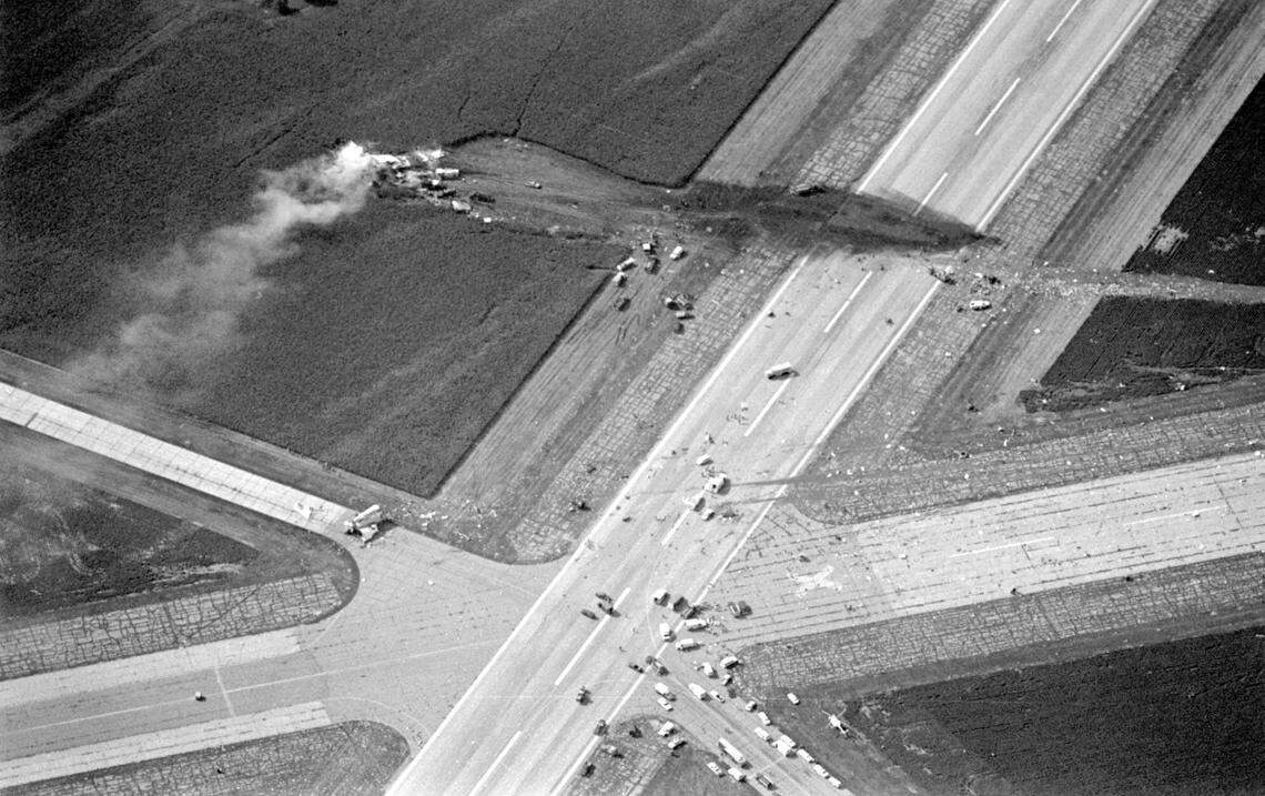 The wreckage of United Flight 232 lies strewn across the runways of Sioux Gateway Airport in Sioux City, Iowa, after the DC-10 aircraft crashed on July 19, 1989. 112 people of the 296 aboard were killed. (AP Photo/The Sioux City Journal, Ed Porter)