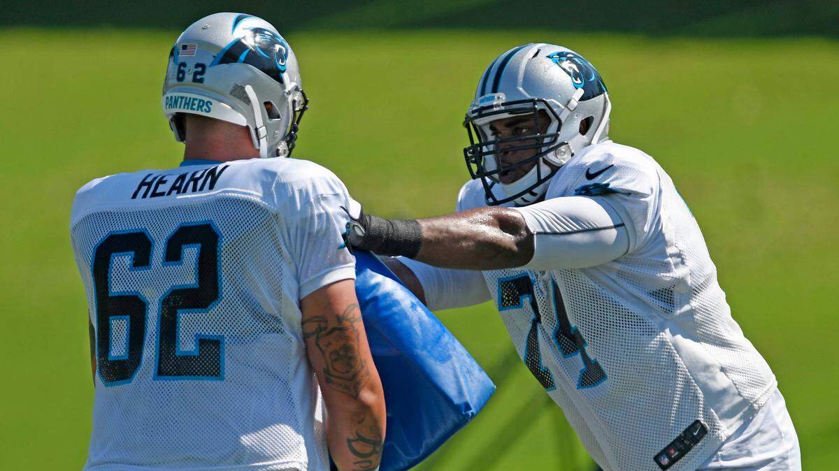 Carolina Panthers offensive tackle Chris Clark (74) works against offensive guard Taylor Hearn (62) during a drill at practice on Wednesday, September 19, 2018.