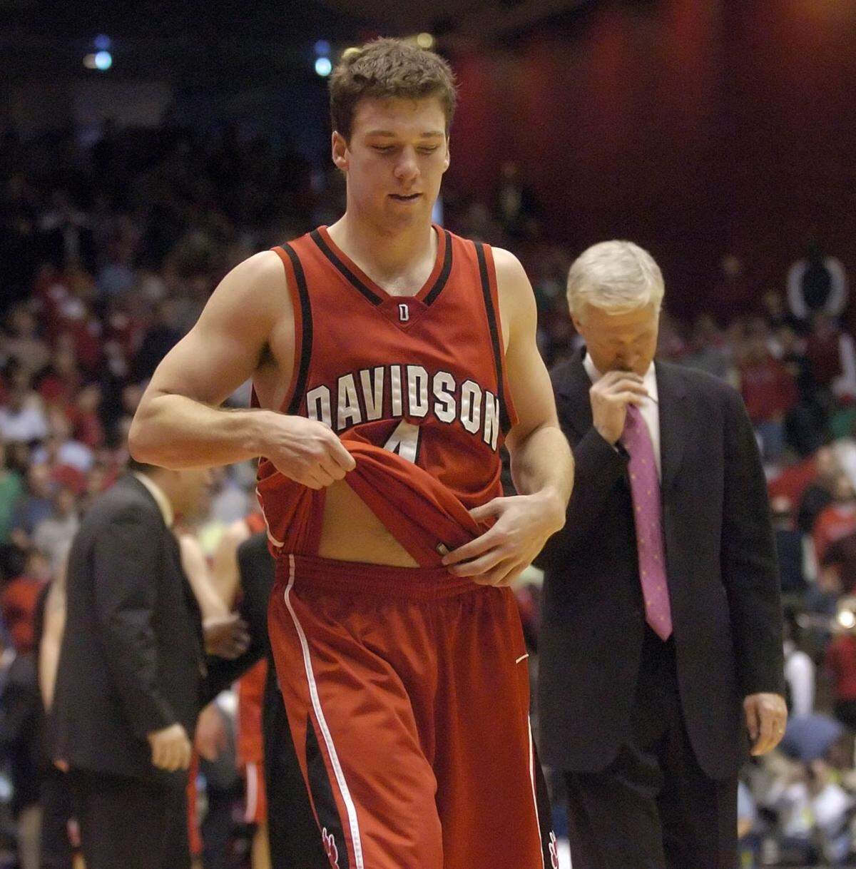 Davidson’s Matt McKillop, left, pulls his jersey, as coach and father Bob McKillop looks down, while walking off the court after Davidson lost to Ohio State, 70-62, in the first round NCAA tournament game at University of Dayton Arena in Dayton, Ohio, Friday, March 17, 2006. (David T. Foster III/Charlotte Observer/KRT)
