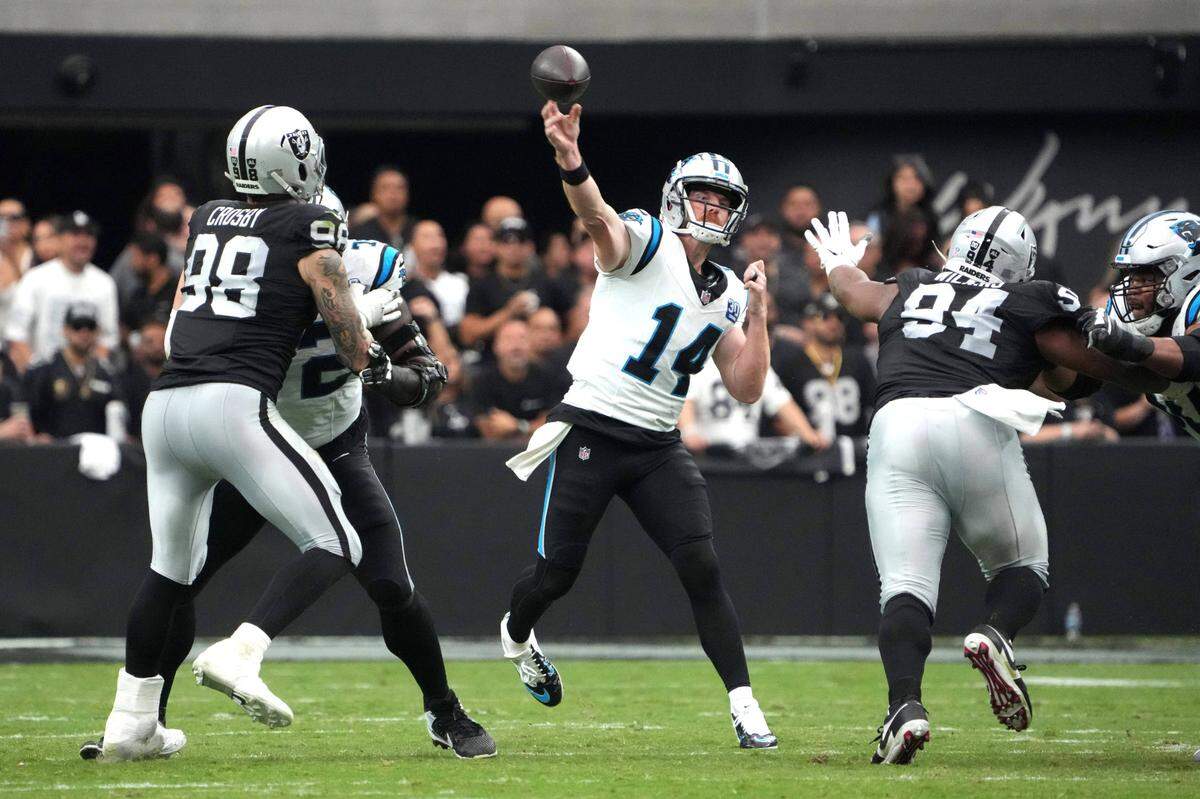 Carolina Panthers quarterback Andy Dalton (14) throws the ball against the Las Vegas Raiders in the first half at Allegiant Stadium. Dalton threw for 212 yards and three touchdowns in the first half alone after replacing Bryce Young as the Panthers starter six days before.