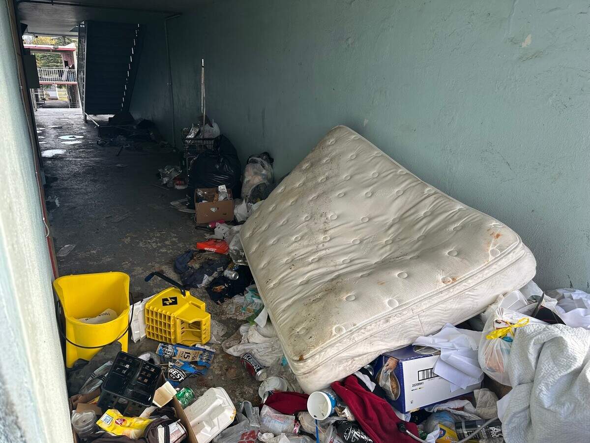 A walkway at the Lamplighter Inn blocked by garbage left behind after tenants were moved out of the property ahead of its closure this week.