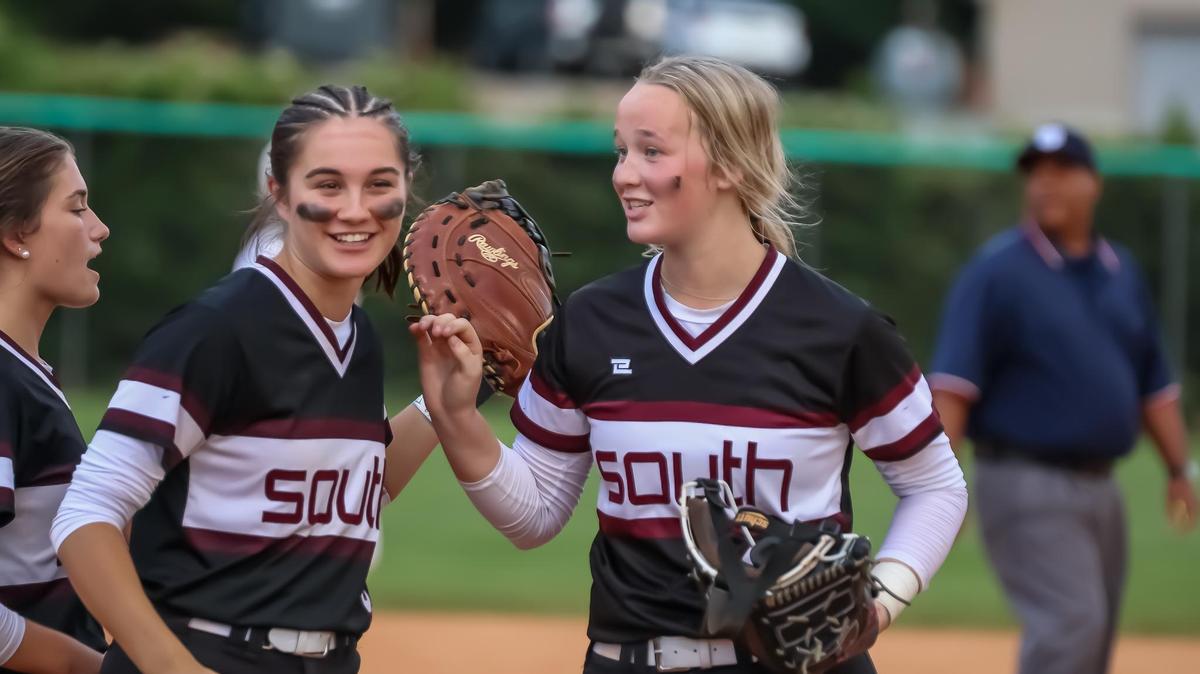 South Caldwell teammates high-five on the field after winning Game 1 of the NCHAA regional softball championship series on May 20th, 2025, at Weddington high school in Weddington, N.C.
