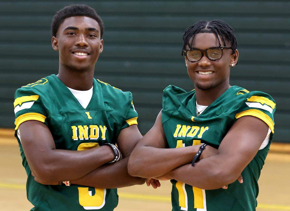 Independence Patriots quarterback Jared Street, left and linebacker Nick Reddish, right, during the Mecklenburg County Power 6 media day on Tuesday, Aug. 5, 2025 at Independence High School.