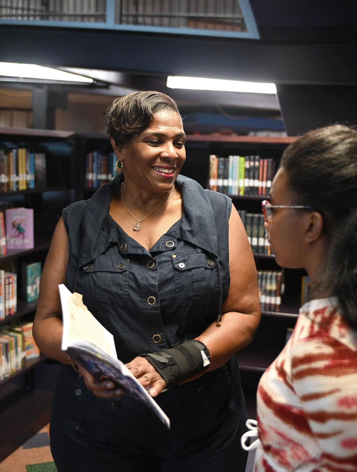 Leslie Scott, left, is a tutor with Reid Park Academy in Charlotte.