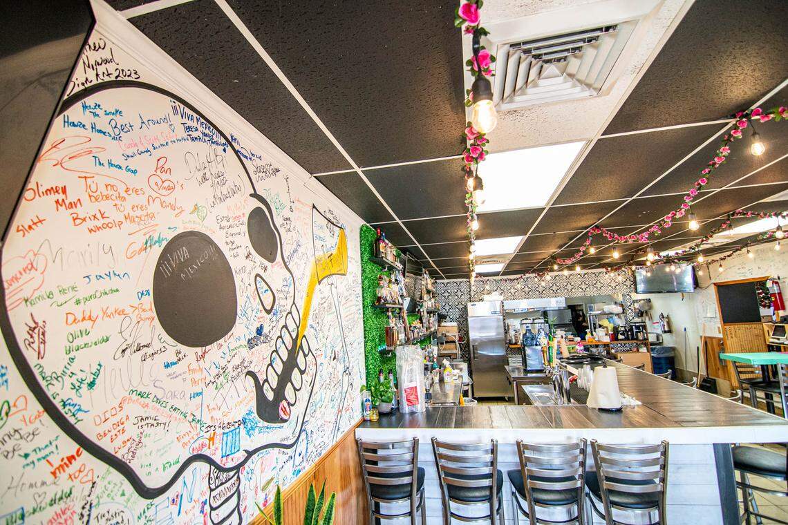 The bar area at Birritaco with a graffiti wall.