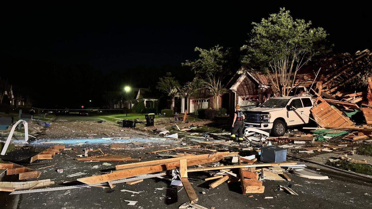 Authorities are investigating a house explosion that damaged homes late Friday near Wilmington, North Carolina. 