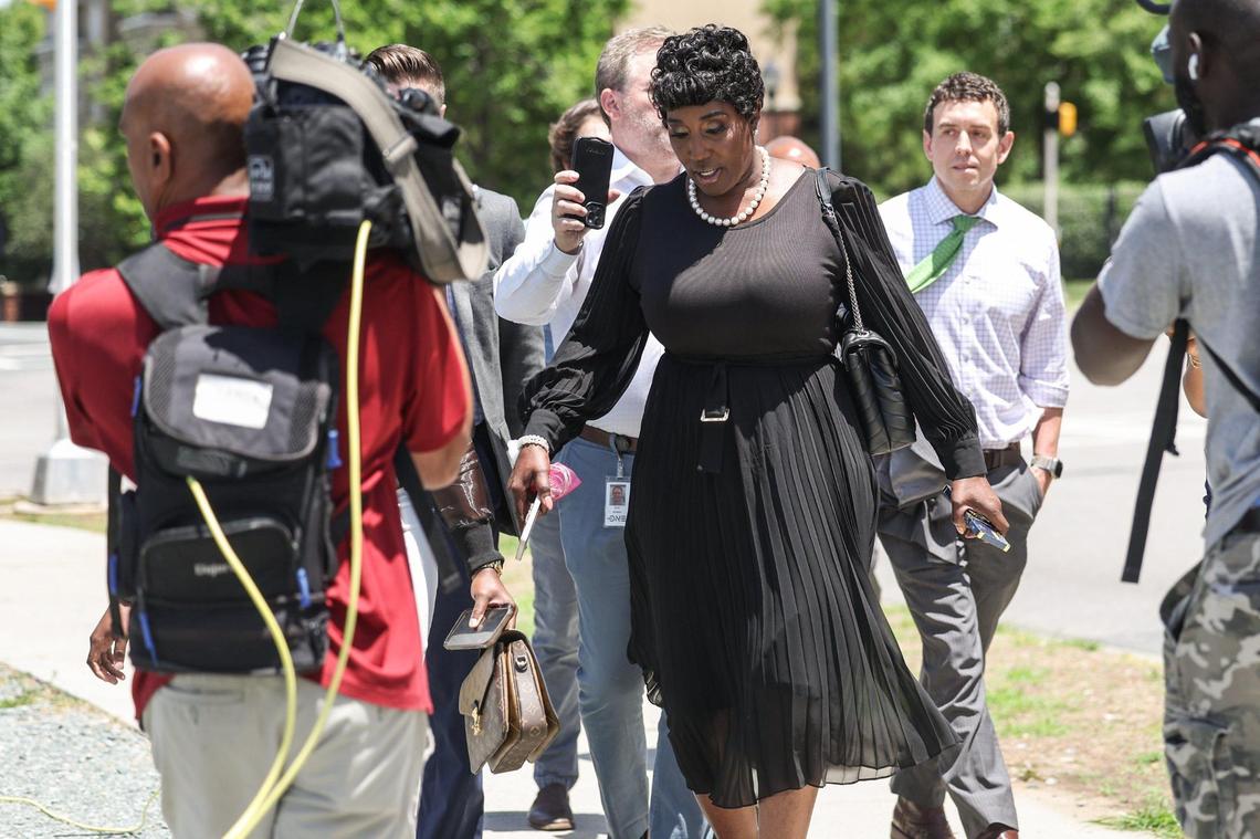 City Councilwoman Tiawana Brown walks and talks with media upon leaving the courthouse in uptown Charlotte on Friday.