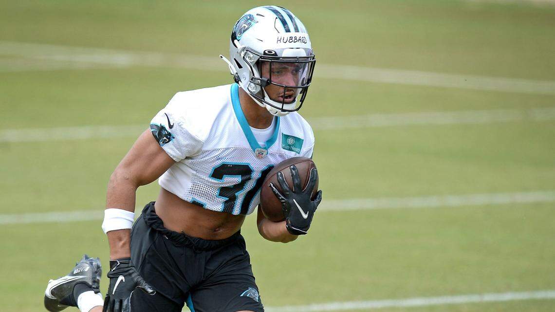 Carolina Panthers rookie running back Chuba Hubbard runs up the field following a handoff during the team’s 2021 rookie minicamp practice on Friday, May 14, 2021.