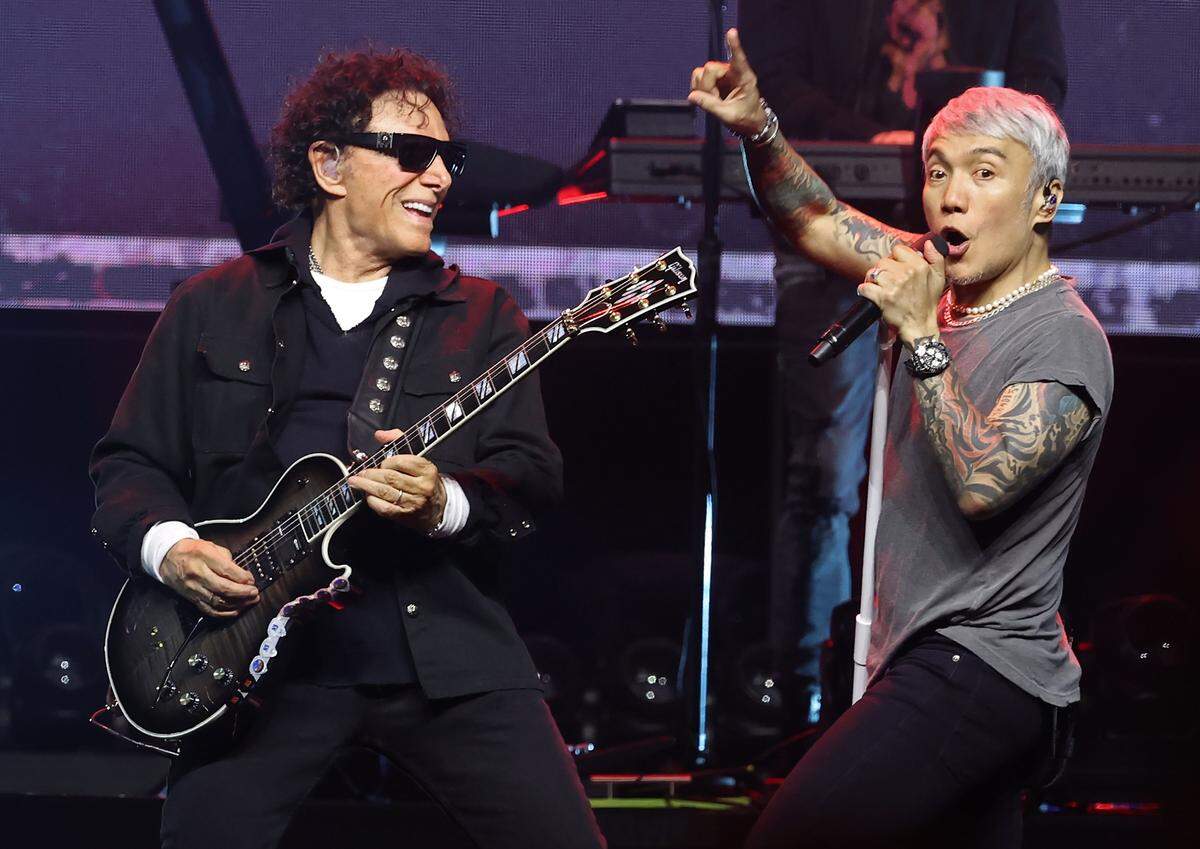 Journey founder and lead guitarist Neal Schon, left, and lead vocalist Arnel Pineda, right, perform during the bands Final Frontier Tour at Spectrum Center in Charlotte, NC on Wednesday, May 20, 2026