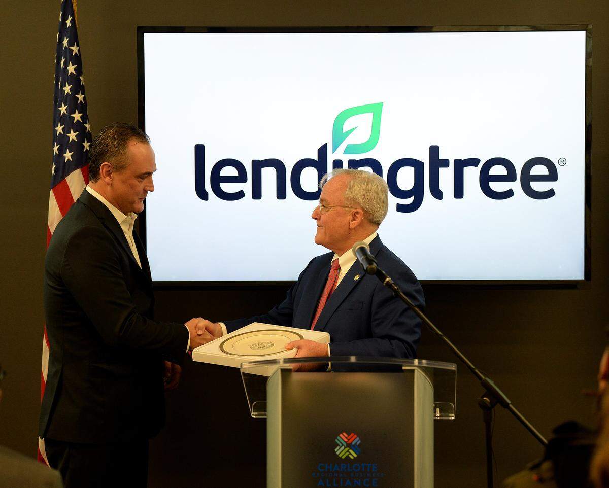 LendingTree CEO Doug Lebda, left, with NC Secretary of Commerce Tony Copeland, at a 2018 announcement that LendingTree would add over 400 high-paying jobs to Charlotte. Lebda and LendingTree are facing contentious claims from a subsidiary in bankruptcy court.