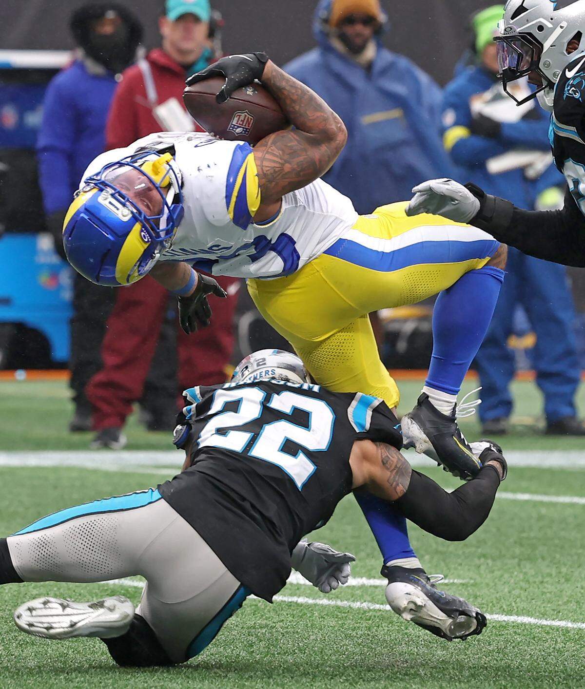 Carolina Panthers safety Lathan Ransom, bottom, upends Los Angeles Rams running back Kyren Williams, top, on a run during action on Nov. 30, 2025, at Bank of America Stadium in Charlotte. The Panthers defeated the Rams 31-28.