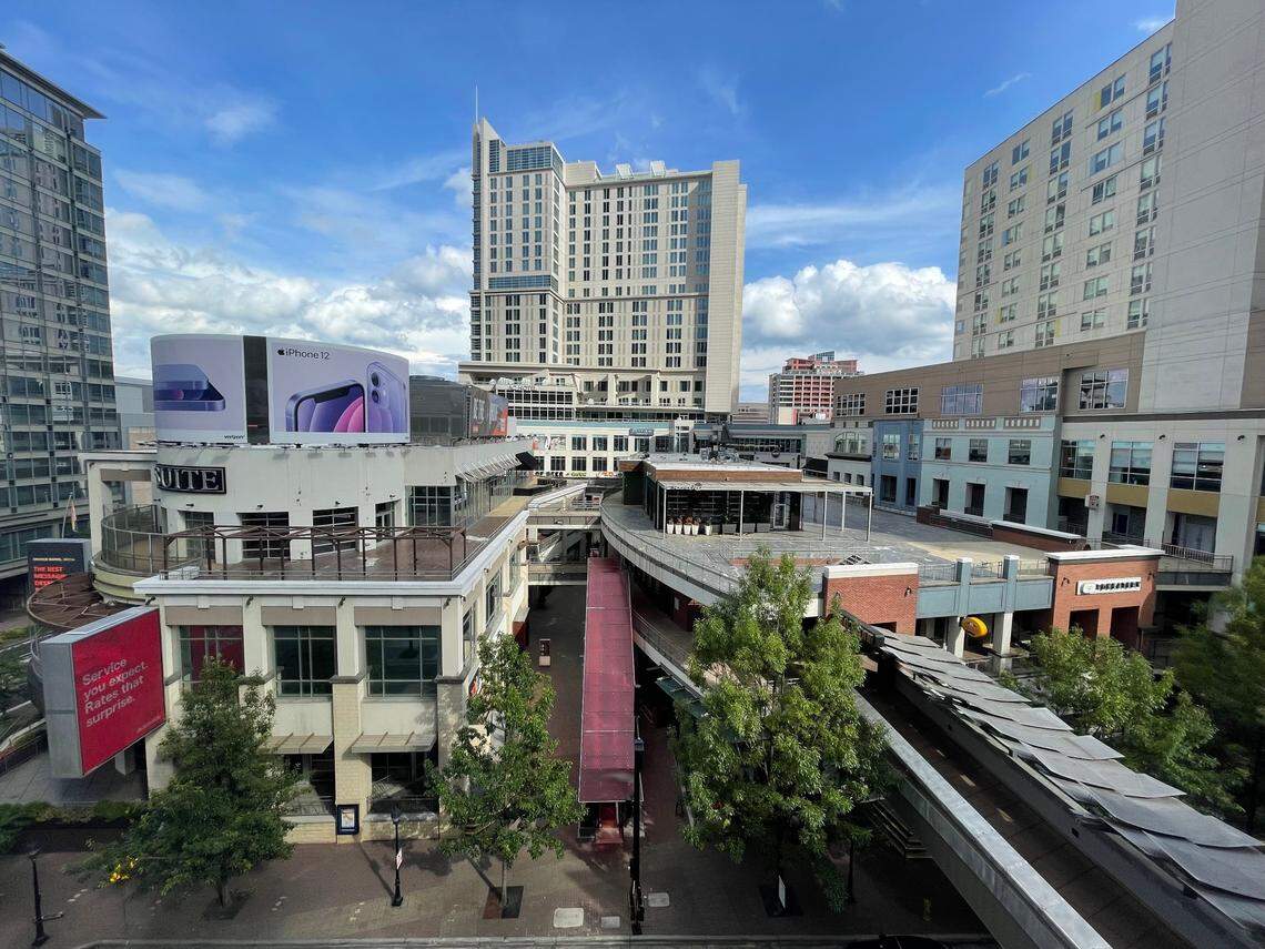 Epicentre in uptown Charlotte, a draw for restaurants, bars and entertainment, has little foot traffic on a Thursday evening in June 2021.
