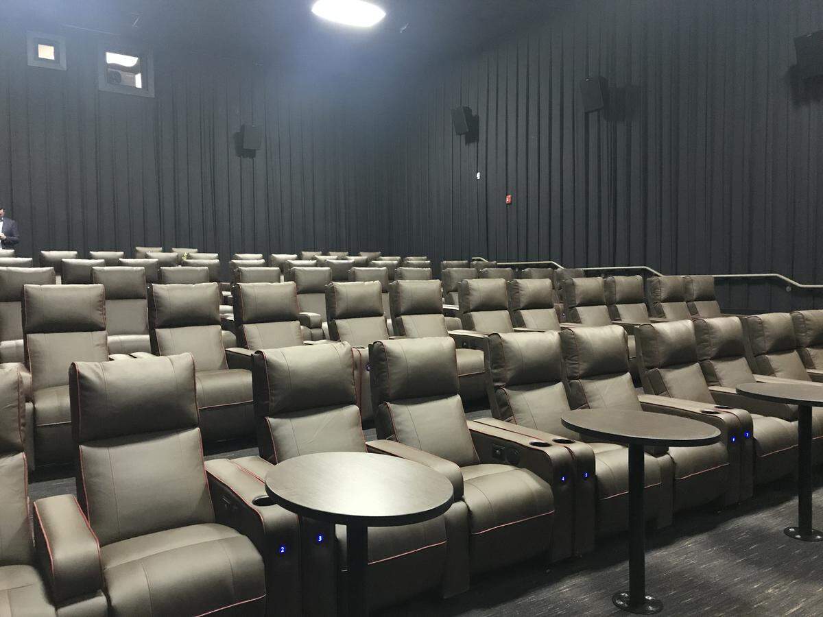 The stadium seating in each of the six theaters at Park Terrace has been ripped out and replaced with wide leather reclining chairs, complete with seat warmers. The beloved theater reopens Friday after a major renovation.