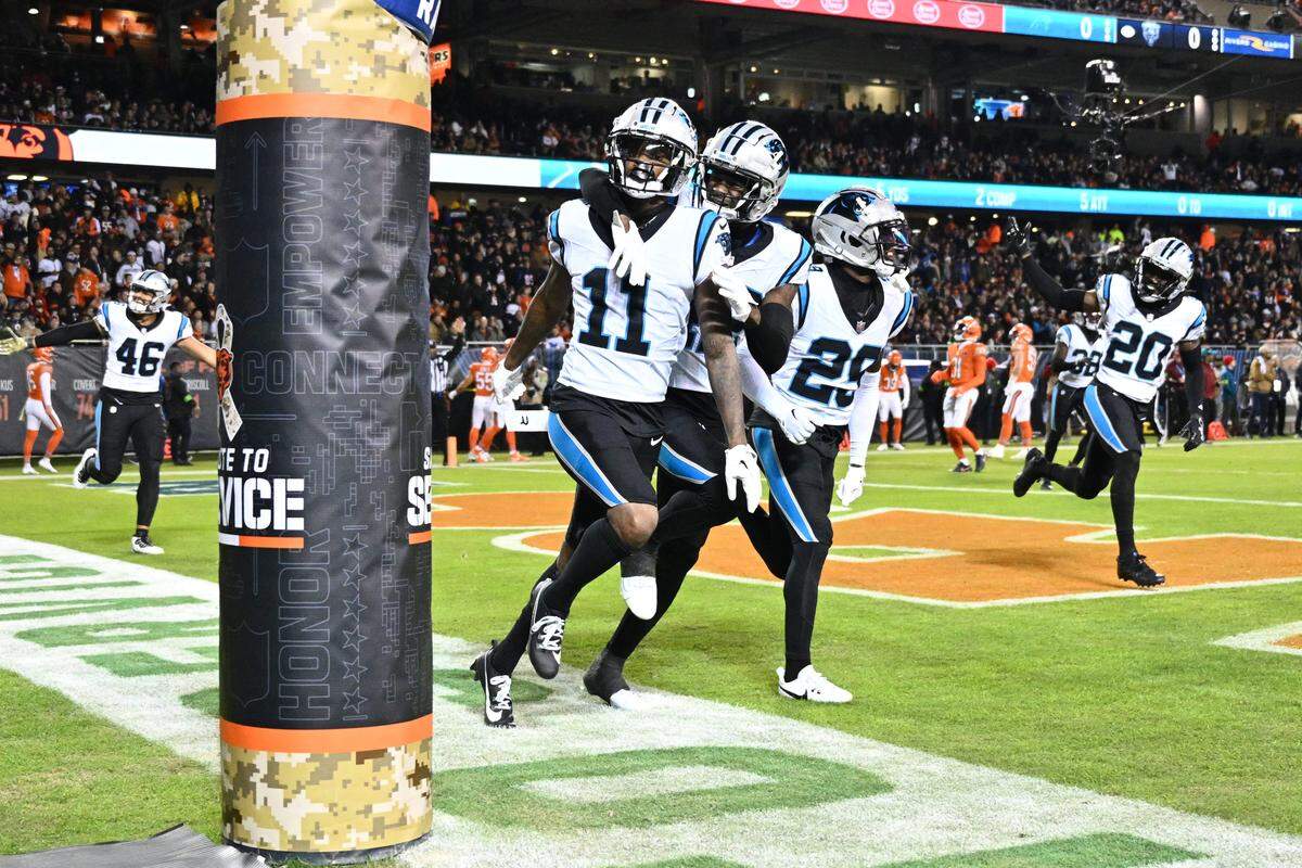 Nov 9, 2023; Chicago, Illinois, USA; Carolina Panthers wide receiver Ihmir Smith-Marsette (11) celebrates after scoring a touchdown on a 79-yard punt return in the first quarter against the Chicago Bears at Soldier Field. Mandatory Credit: Jamie Sabau-USA TODAY Sports
