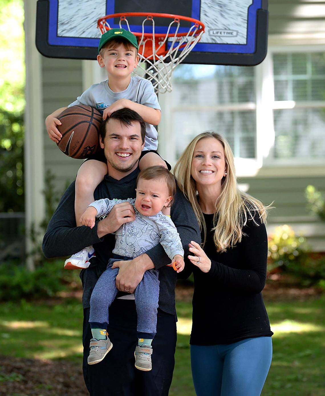 Charlotte 49ers head football coach Will Healy with his wife, Emily, and sons Eli and Wynn.