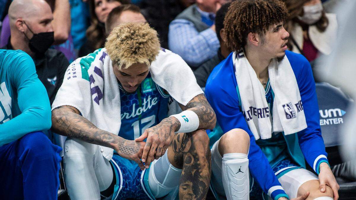 The Hornets guard Ja Morant hangs his head on the bench during the game against the Grizzzlies at Spectrum Center on Saturday, February 12, 2022 in Charlotte, NC. The Hornets lost to the Grizzlies, 125-118, making the sixth consecutive loss at home.
