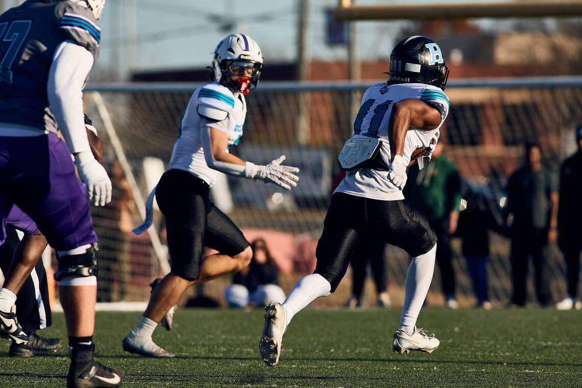 Hough DB Jason Wilkerson (11) runs back his second interception of the day to give the East Team the lead in the second half of the Queen City Senior Bowl hosted at Olympic High School.
