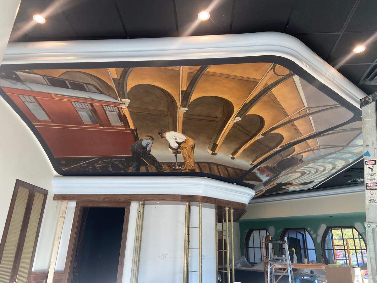 The Link & Pin mural at the third location in South Park pays homage to the restaurant’s name derived from a railroad term referring to Charlotte’s first railroad line in South End and city’s light rail.