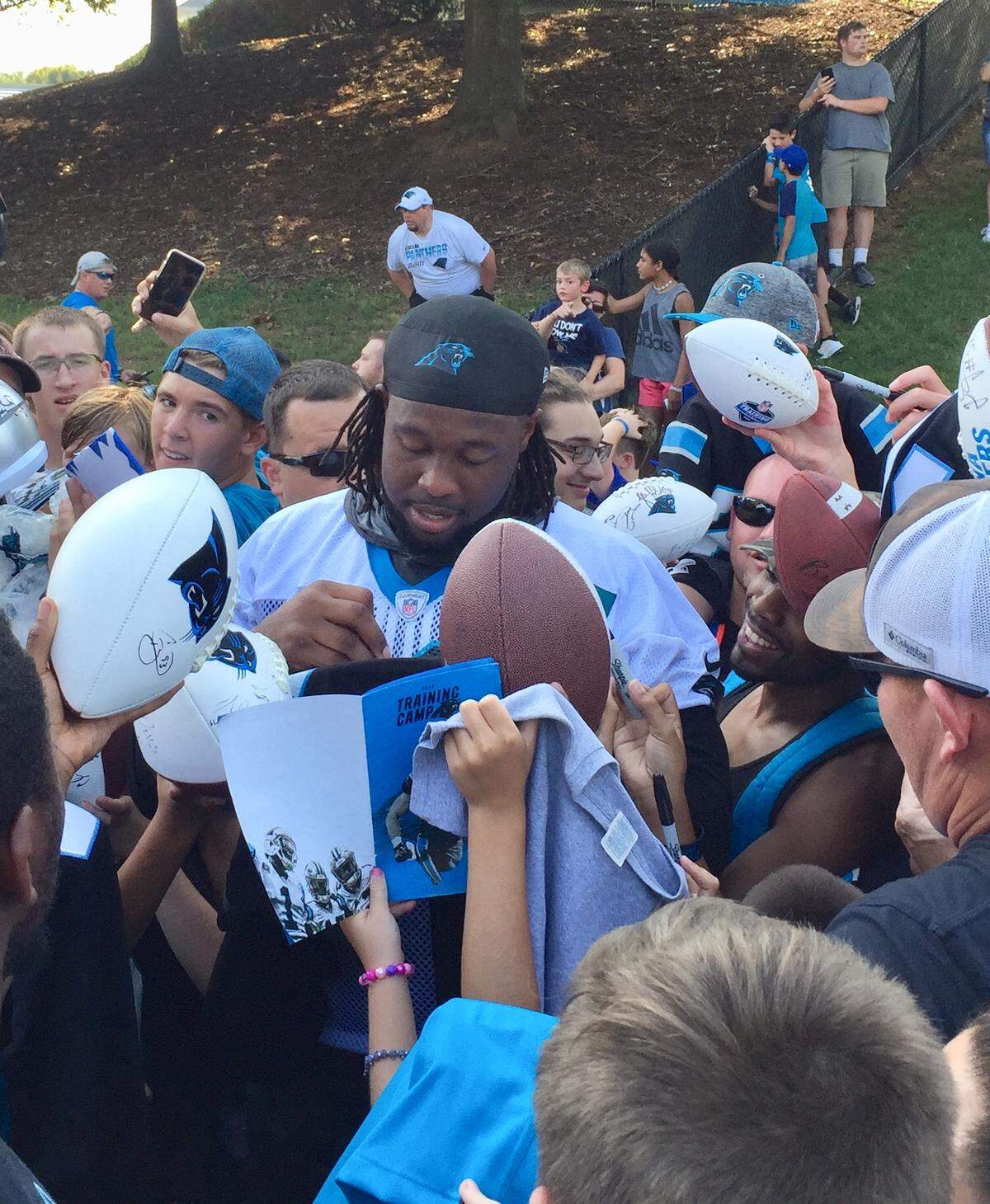 Panthers defensive tackle Gerald McCoy has made it a habit during his first Carolina Panthers training camp to wade into the crowd and sign autographs.