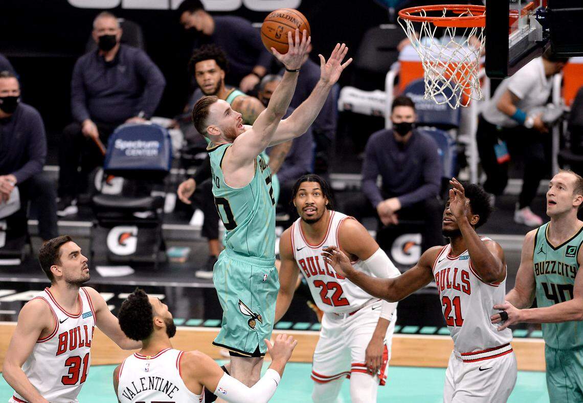 Charlotte Hornets forward Gordon Hayward, center, drives the lane for a shot as the Chicago Bulls defense looks on during first half action on Friday, January 22, 2021. The Bulls defeated the Hornets 123-110.