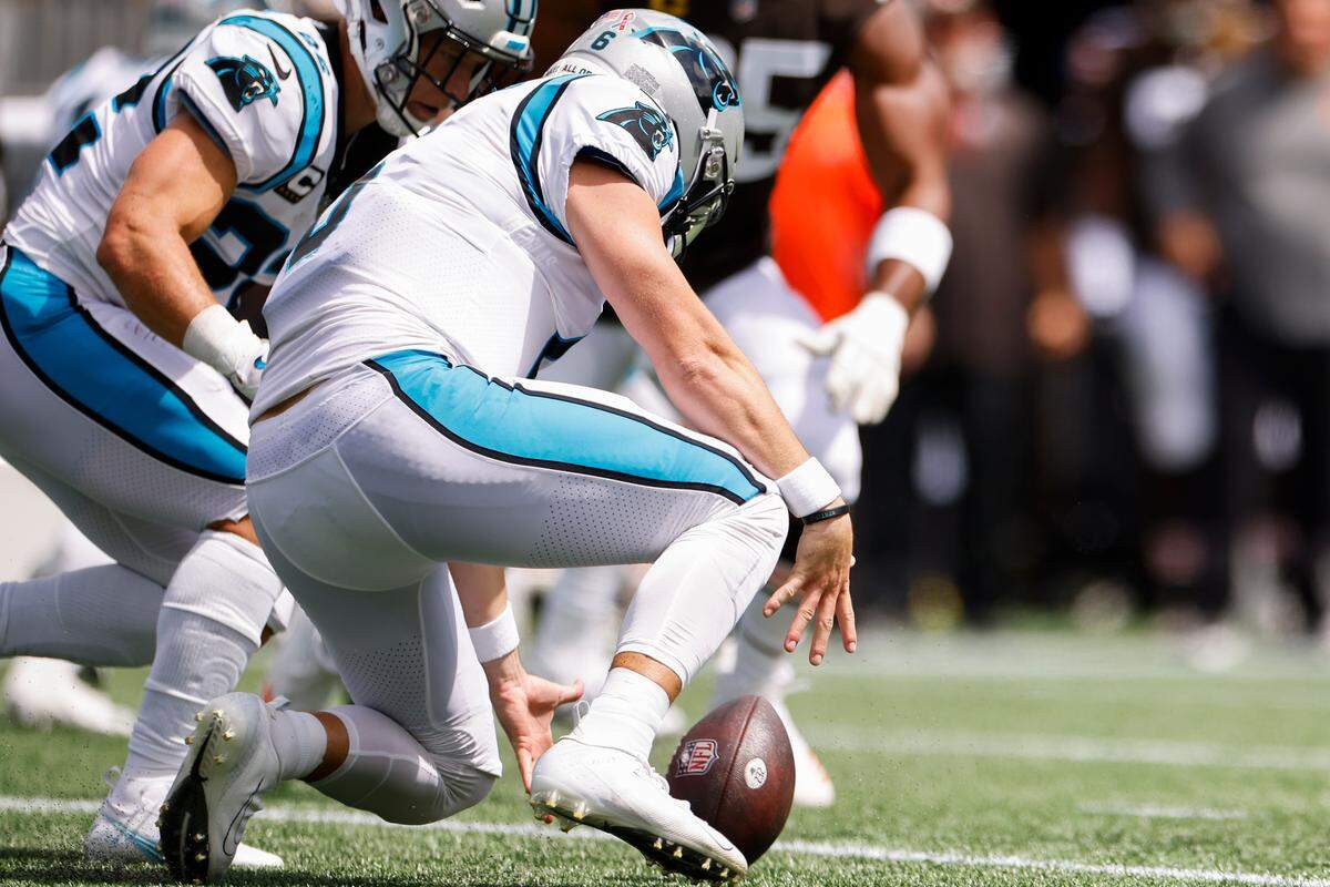 Carolina Panthers quarterback Baker Mayfield (6) fumbles a snap during a game against the Cleveland Browns at Bank of America Stadium in Charlotte, N.C., Sunday, Sept. 11, 2022.