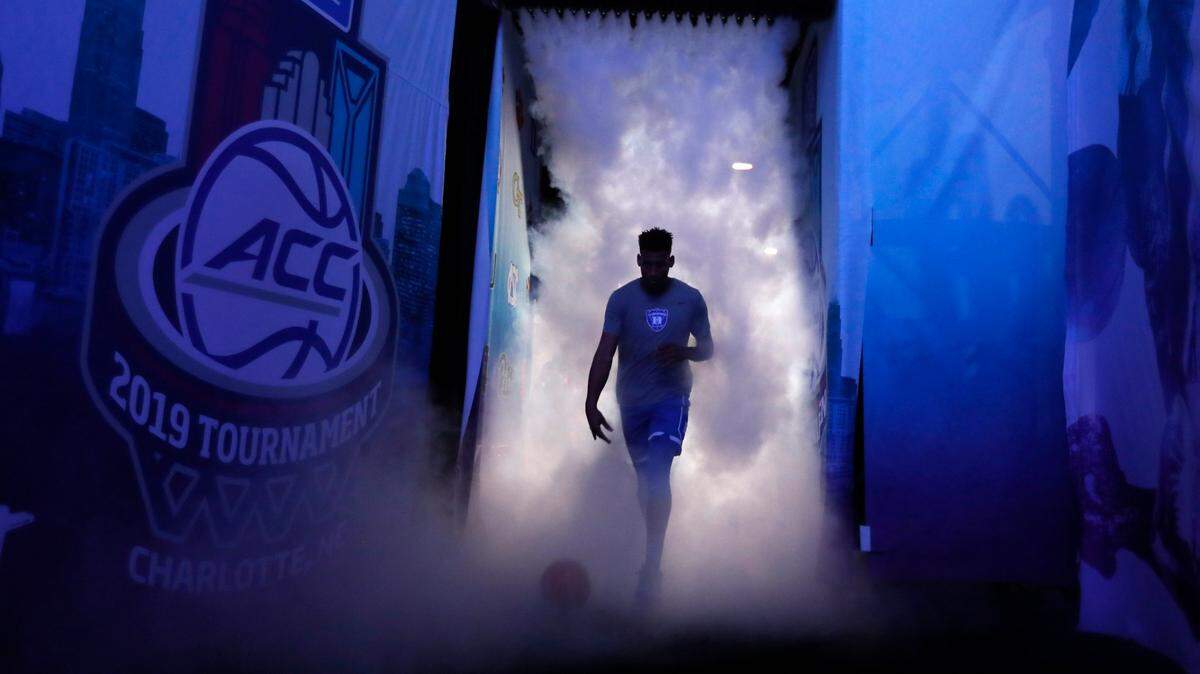 Duke’s Javin DeLaurier (12) leads the team onto the court before Duke’s game against UNC in the semifinals of the 2019 ACC Tournament in Charlotte, N.C., Friday, March 15, 2019.