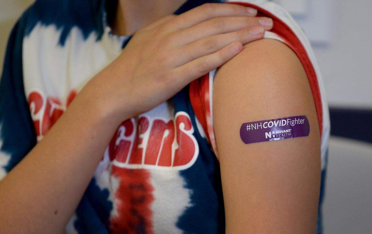 Novant Health doctors urge North Carolinians to get the COVID-19 shots as hospitalizations rise.