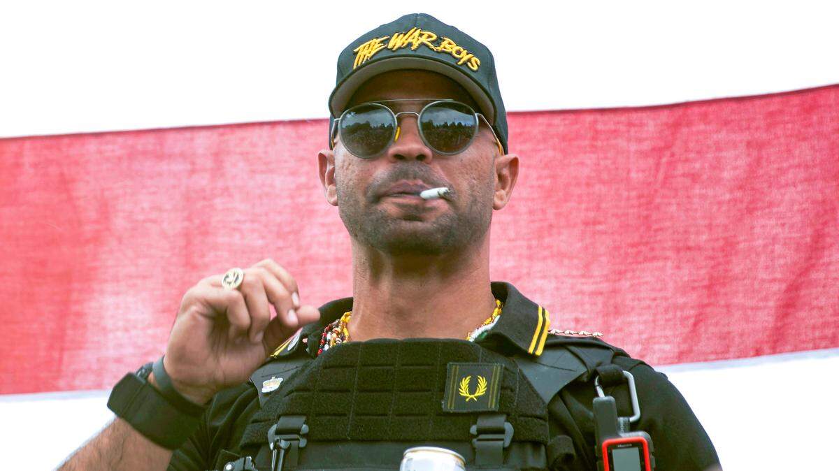 Former Proud Boys national chairman Henry “Enrique” Tarrio wears a hat that says The War Boys during a rally in Portland, Ore., Sept. 26, 2020.