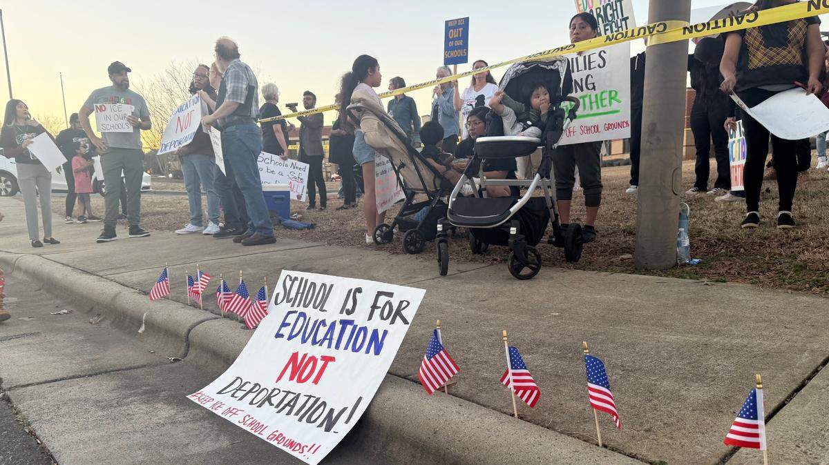 Protesters gather ahead of a Union County Public Schools board meeting Feb. 4, 2025 in Monroe. Attendees say they want the district to outline protections for undocumented students.