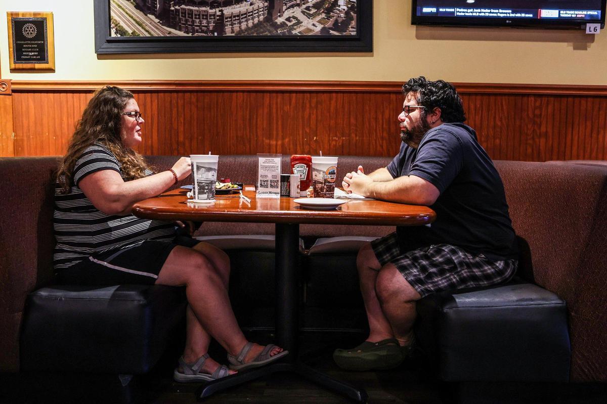 Becky and Daniel Spaulding eat dinner at Dilworth Neighborhood Grille on Monday, August 1, 2022 in Charlotte, NC.