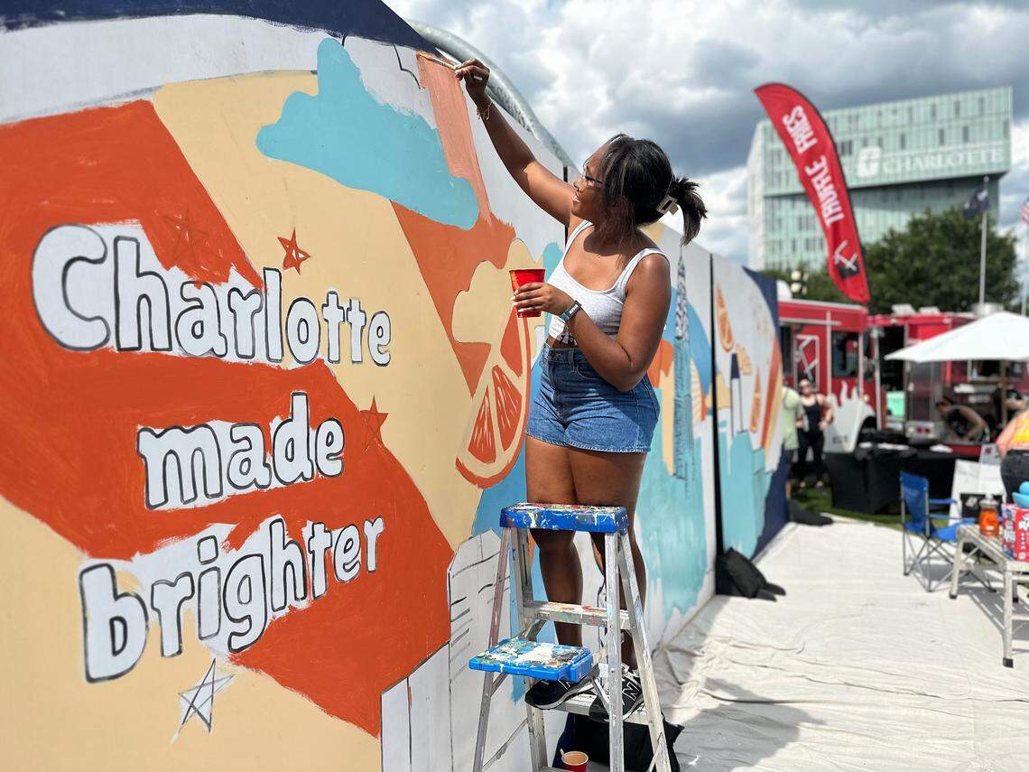 A live mural for fans to paint at Lovin’ Life Music Fest in uptown Charlotte.