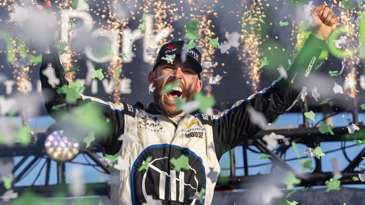 Ross Chastain celebrates after winning a NASCAR Cup Series auto race at Circuit of the Americas, Sunday, March 27, 2022, in Austin, Texas. (AP Photo/Stephen Spillman)