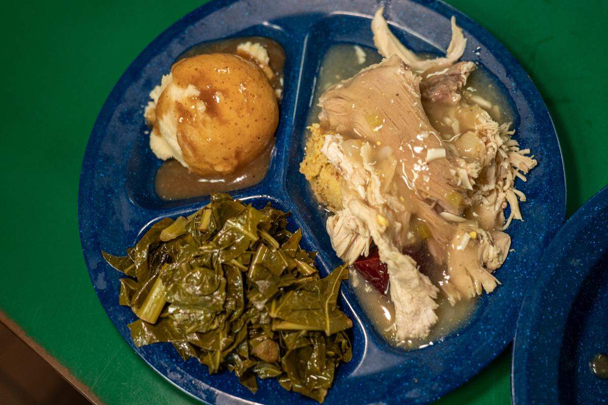 Turkey and dressing with collards and mashed potatoes with gravy at Circle G restaurant.