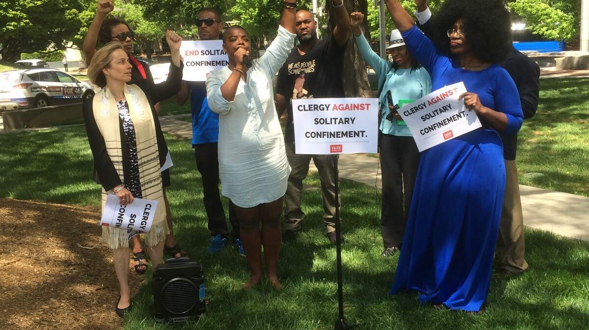 Clergy members and former inmates gathered near the Mecklenburg County jail Thursday afternoon to speak out against the use of solitary confinement in the county.
