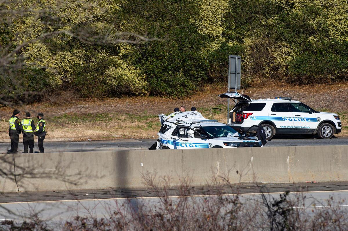 Charlotte-Mecklenburg police and North Carolina State Highway Patrol troopers investigate the scene of a crash on Interstate 85 near the WT Harris Boulevard exit that killed Officer Mia Goodwin and injured three others on Wednesday, December 22, 2021 in Charlotte, NC.