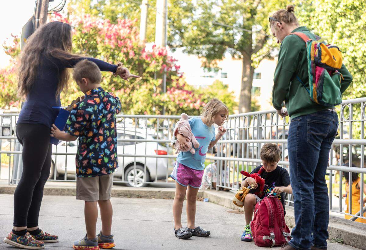 Students arrive for the first day of school at Elizabeth Traditional School in Charlotte, N.C., on Monday, August 25, 2025.