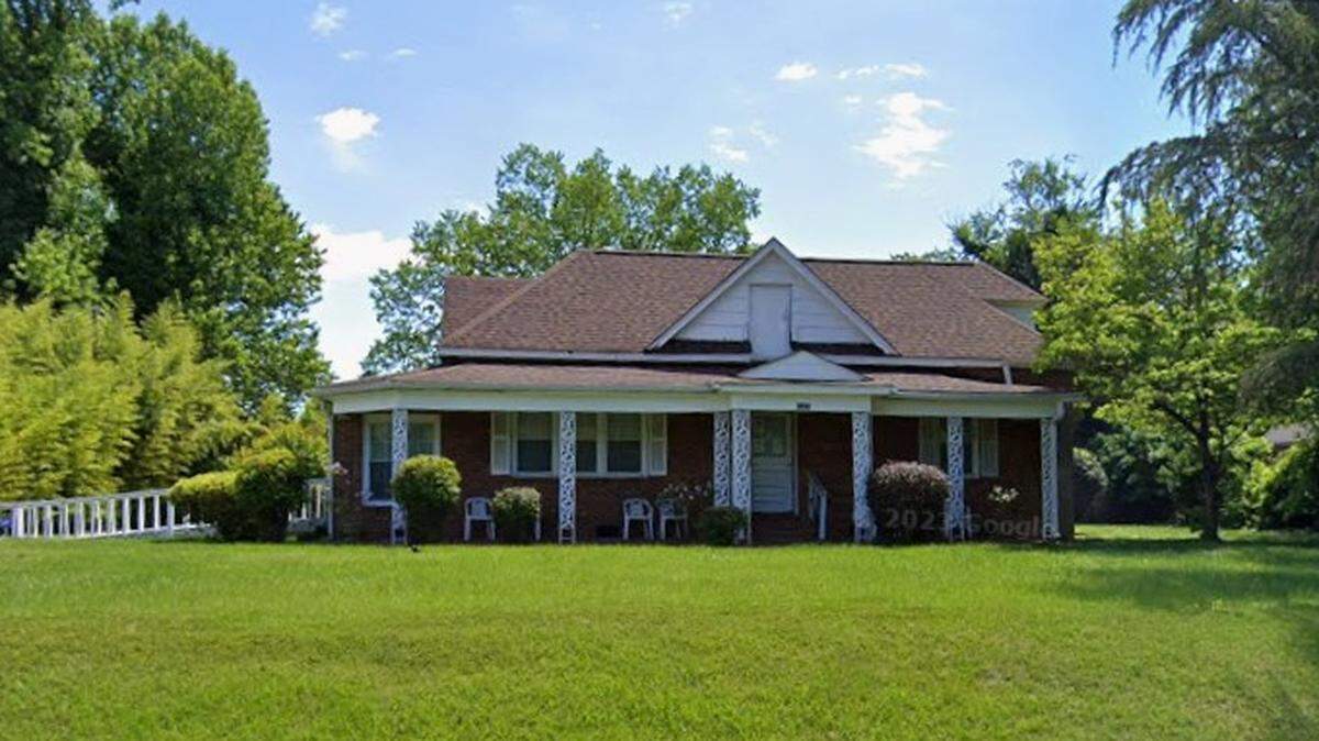 A North Carolina woman was arrested Friday, accused of operating an unlicensed care facility in this home where a 74-year-old man vanished in July.