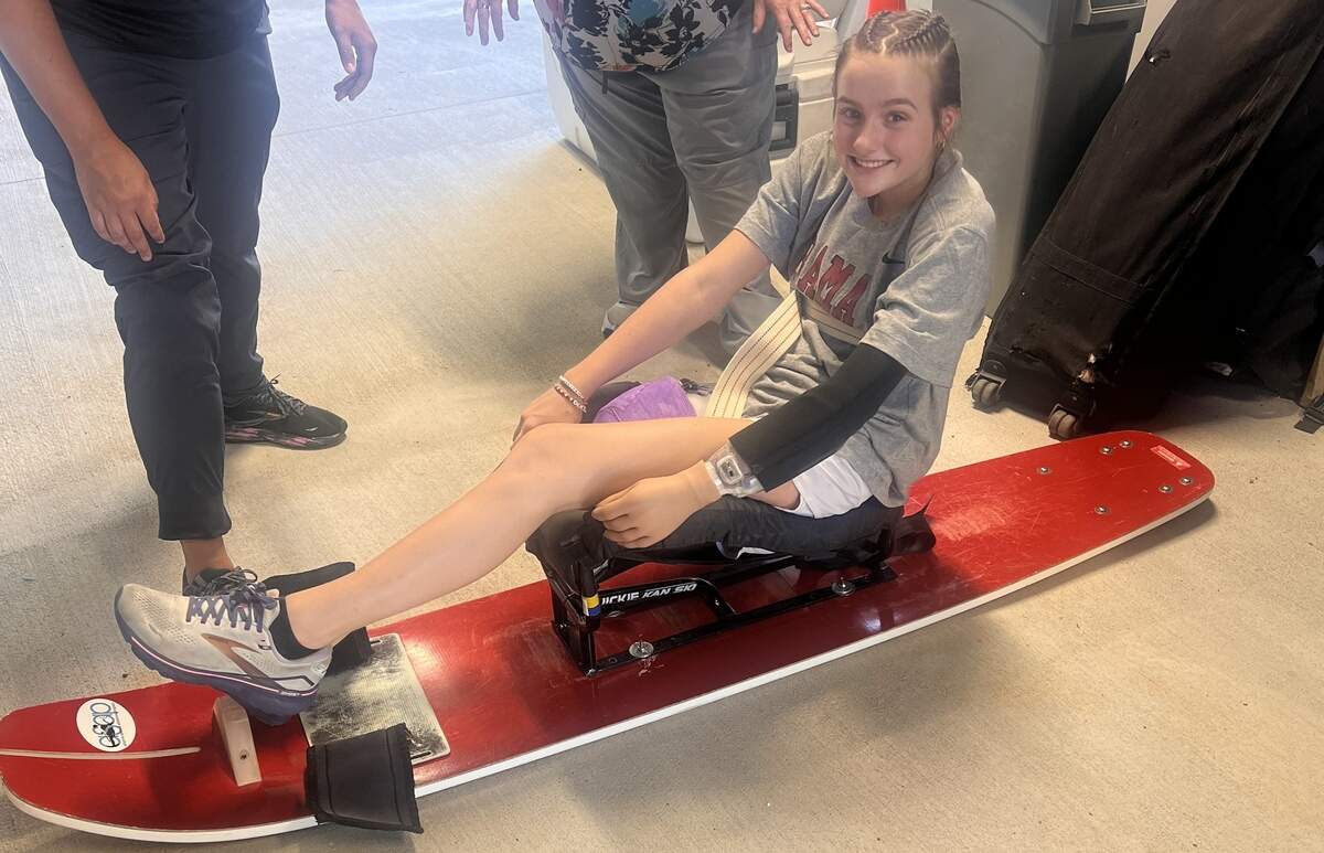 Says Lulu Gribbin, shown here getting fitted into an adaptive water ski last year: “I can’t do everything that I used to do, so it’s definitely been hard, and I’ve had to give myself grace and be patient with myself — but it’s taught me to just learn and try. You never know, until you try.”