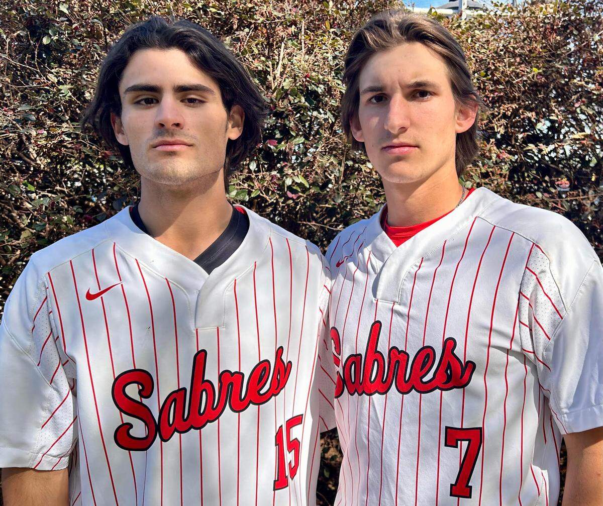 Brody Taylor (left) and Greyson Little are teammates on the baseball team at South Mecklenburg High School. On April 4, 2023, they witnessed a fatal car crash in front of the school, then called 911 and assisted with the rescue of two people from one of the cars.