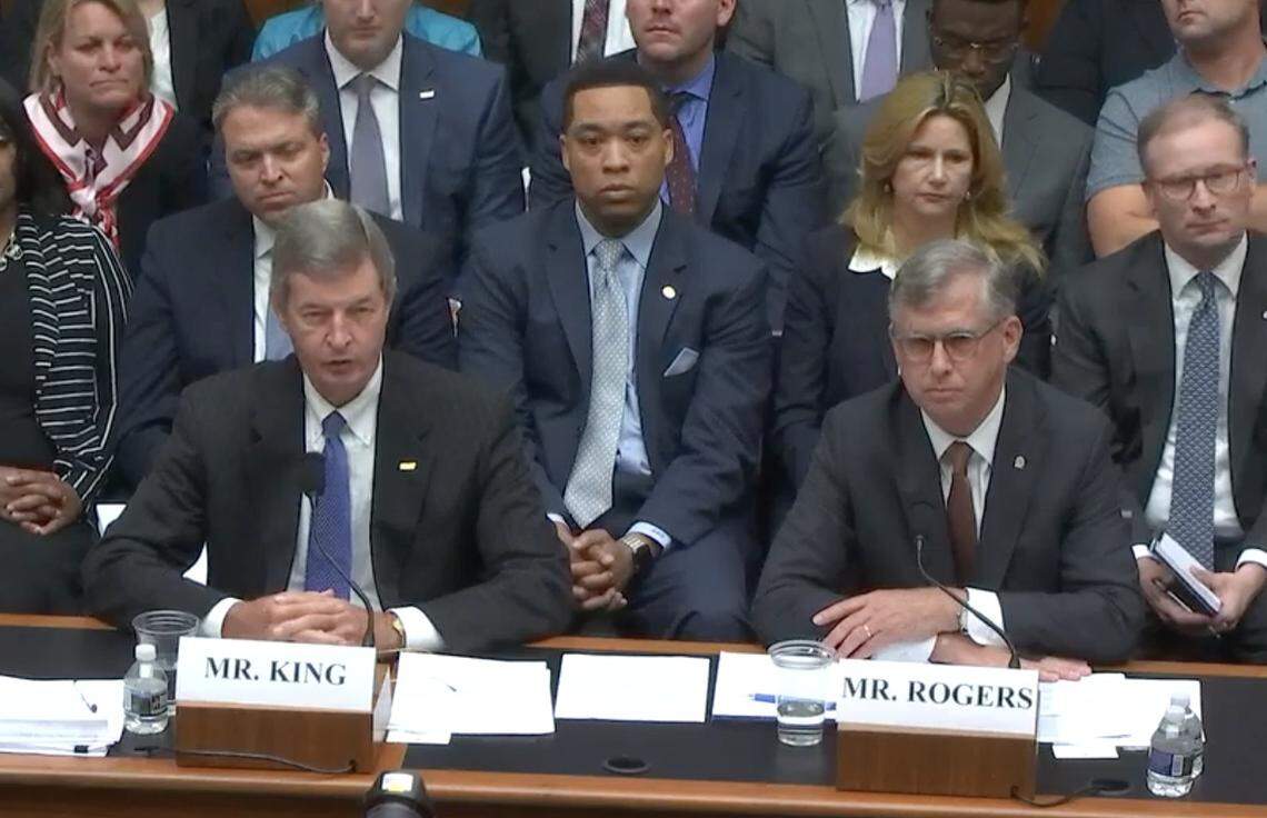 BB&T CEO Kelly King and SunTrust CEO Bill Rogers answer questions from the Financial Services Committee at a July hearing.