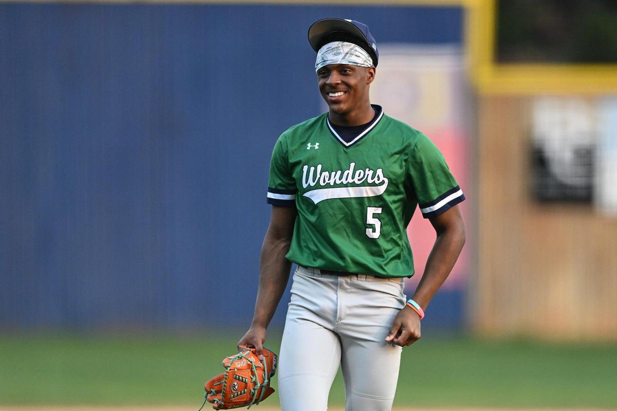 A.L. Brown pitcher C.J. Gray (5) smiles during a varsity baseball game against East Mecklenburg, Thursday, March 13, 2024, in Charlotte, N.C. (Charlotte Observer/Matt Kelley)