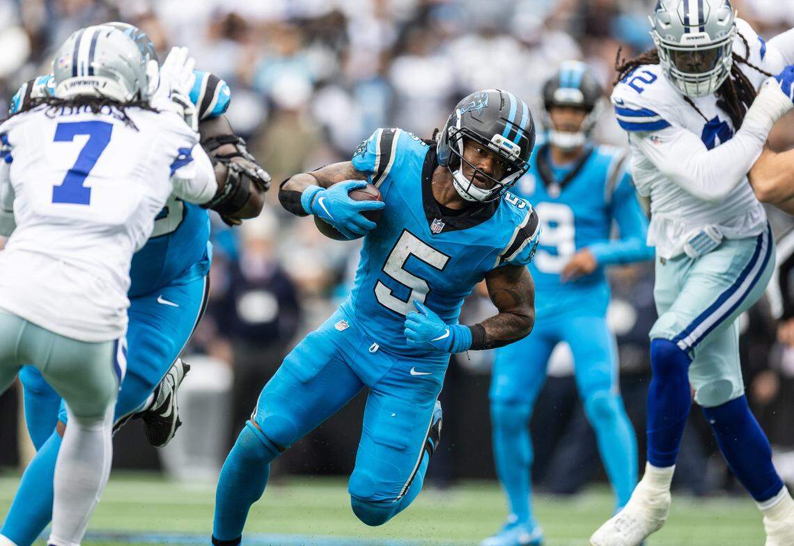 Carolina running back Rico Dowdle set a franchise record with 239 yards from scrimmage Sunday in the Panthers’ 30-27 win over Dallas.