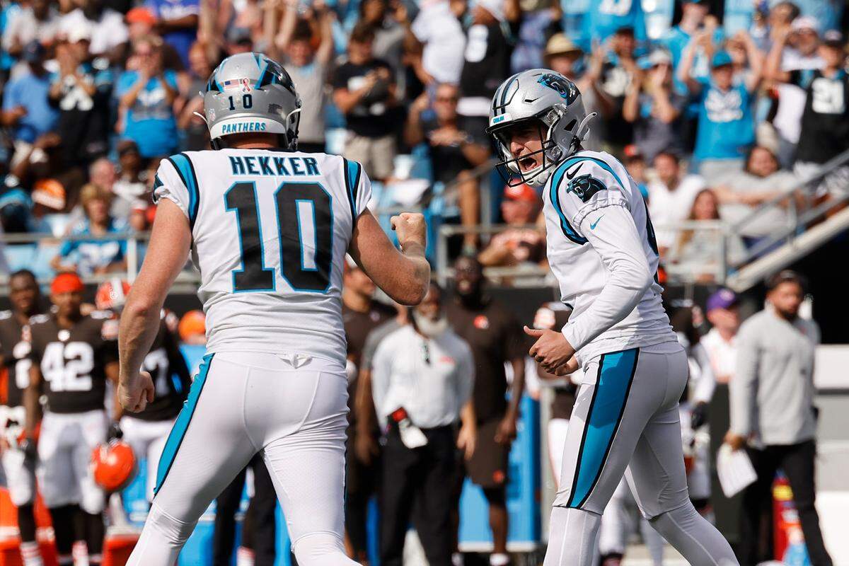 Carolina Panthers place kicker Eddy Pineiro (4) celebrates a field goal with Carolina Panthers punter Johnny Hekker (10) in the fourth quarter during a game against the Cleveland Browns at Bank of America Stadium in Charlotte, N.C., Sunday, Sept. 11, 2022.