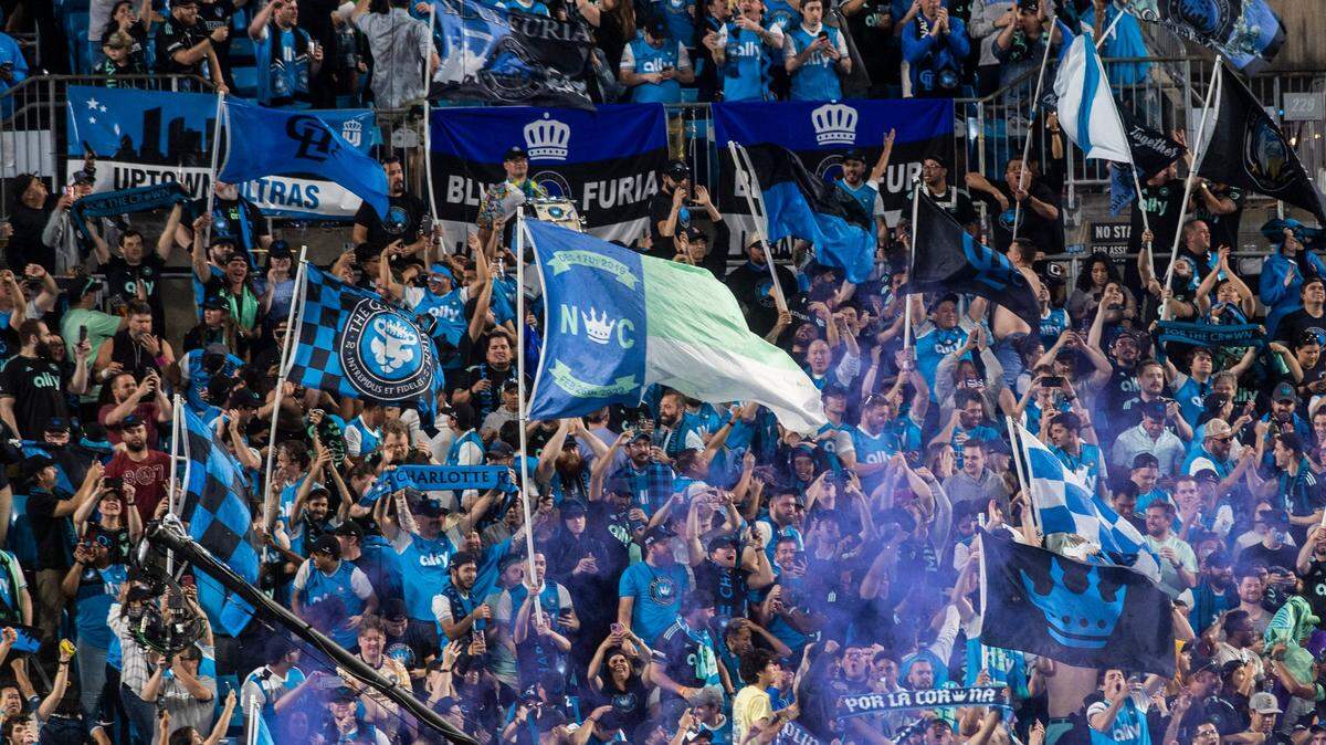 Fans celebrate after a goal by Charlotte FC during the game against the New England Revolution at Bank of America Stadium on Saturday, March 19, 2022 in Charlotte, NC.