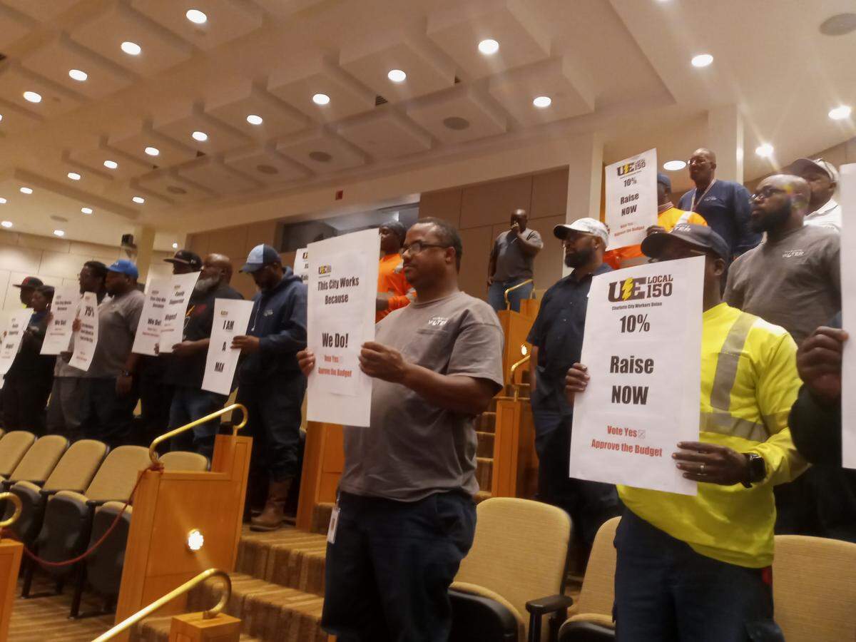 Charlotte city workers and union members speak to the Charlotte City Council on Monday.