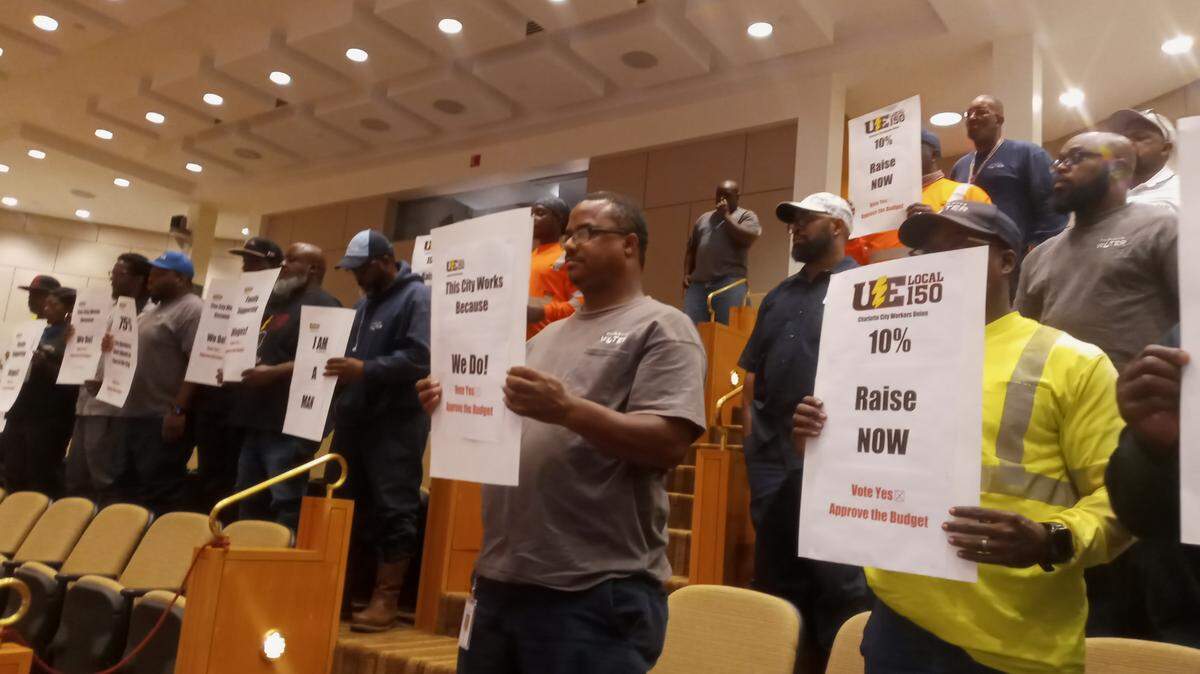 Charlotte city workers and union members speak to the Charlotte City Council on Monday.