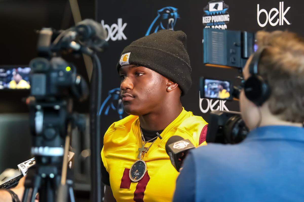 West Charlotte’s KD Cotton answers questions from the media during Wednesday’s Carolina Panthers Keep Pounding Classic media day at Bank of America Stadium on May 7 2025
