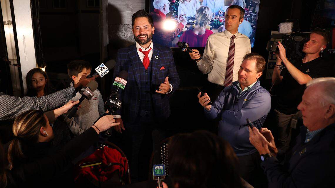 Tariq Bokhari speaks to the media after winning the race for Charlotte City Council’s District 6 seat at Selwyn Pub in Charlotte Tuesday night.